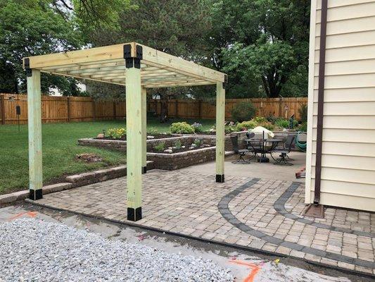 Wood pergola with paver patio in Crete, NE.