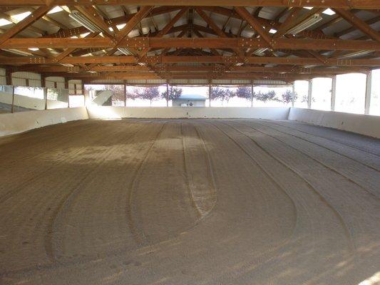 Indoor arena 80' x 140' w/ insulated roof, rubber / sand footing, mirrored wall, lighting, watered & groomed daily.