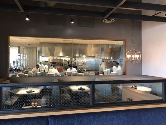 A view from our dining room of the scratch kitchen and skilled cooks.