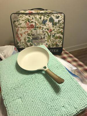 New pan, bath mat, and bedding set from HomeGoods, the pan was around $10 and the queen bed set including quilt and 2 pillowcases $60.