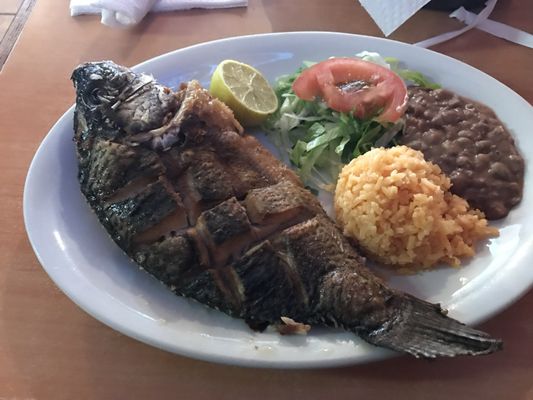 Whole fried fish, rice, and beans. This is my go to .