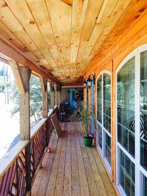 Reclaimed tongue and groove ceilings on covered porch