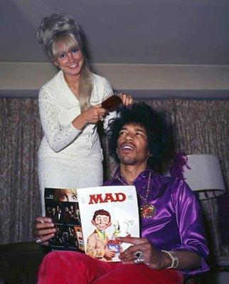 jimi getting his hair done while reading Mad Magazine.