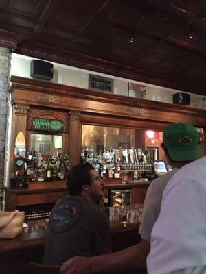 Classic bar with gorgeous old wood work.