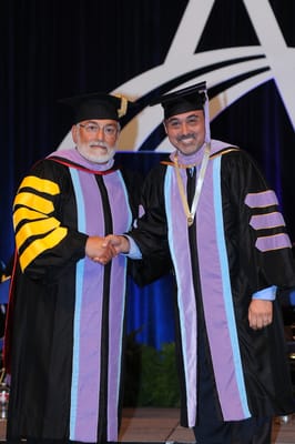 Dr. Fatemi receiving his Fellowship award from the president of Academy of General Dentistry in San Diego, 2011