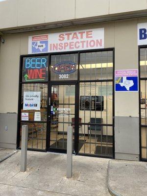 Repair shop entrance and hours of operation signage