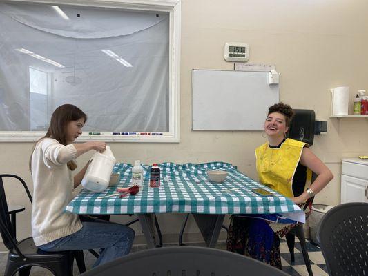 Two students working on an art project