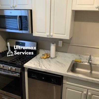 Kitchen counter top, stove, and sink.