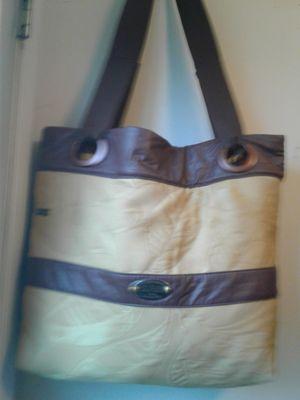 D.I.L.B brand  Tote with zipper closure                                       Lt. Gold w/ faux leather trim Eyelet top w/ webbed handles