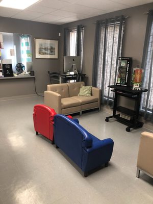 Waiting area with kid friendly seating. Computer to complete surveys