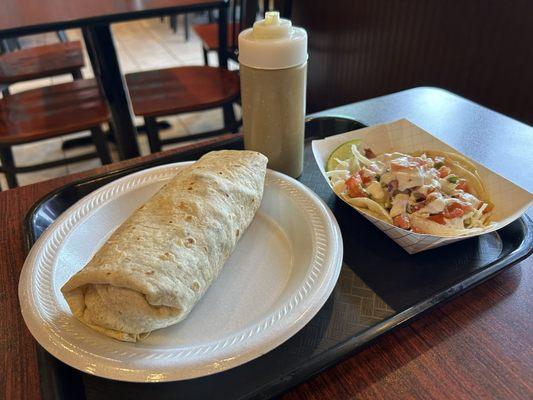 Burrito con carne asada. And fish taco.