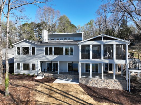 Exterior Home Facelift: Lake Lanier views with a new outdoor screened porch, TimberTech composite decking, stone floor under deck patio