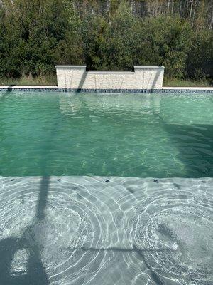 New pool with bubblers on the sun shelf and sheer descent riser.