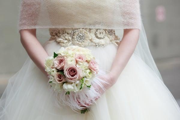 Romantic bridal bouquet of roses, freesia, ranunculus, hydrangea & ostrich feathers. Four Seasons, Seattle Kelly Chandler Photo