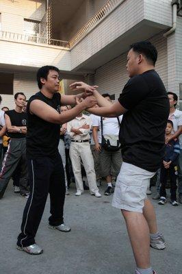 Sifu Kao playing Chi Sao in Foshan-China with various Wing Chun schools.