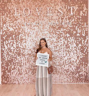 Cute photo backdrop and sign when you buy your dress!