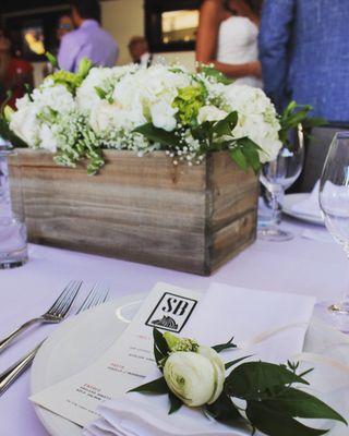 Wedding Centerpieces from the lovely Allen wedding. White and green theme wedding reception with ranunculus corsages for the mommas