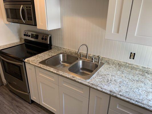 New kitchen installed, cabinets and countertops and appliances.