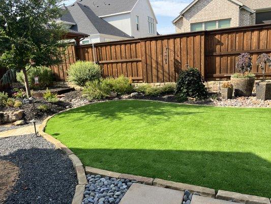 Awesome Backyard with elegant synthetic turf plus Mexican pebble