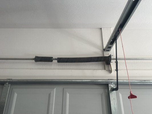 Broken garage door spring replacement needed