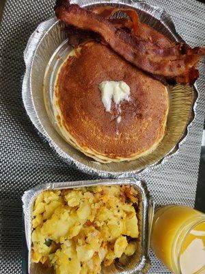 Pancakes, bacon and side of home fries.