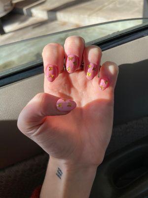 Pink nails with gold butterflies