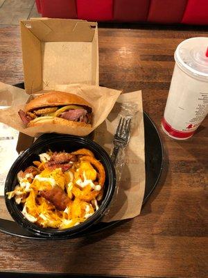 Beef brisket sandwich and loaded curly fries.