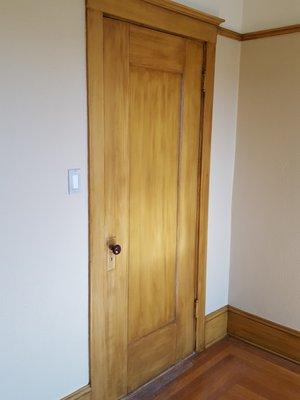 A beautifully refinished wood door.