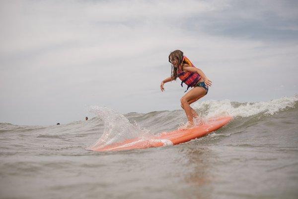 Surfing Lake Michigan at kids' beach camp.