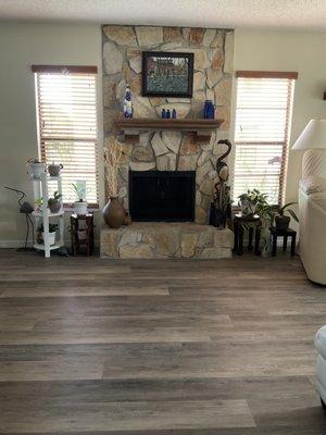 Beautiful laminate flooring. Laid in beautifully at the fireplace. The floor color really blends in with the hearth.