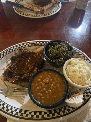 Half rack ribs. Half was on the other plate. Baked beans, collards, slaw, and hush puppies.