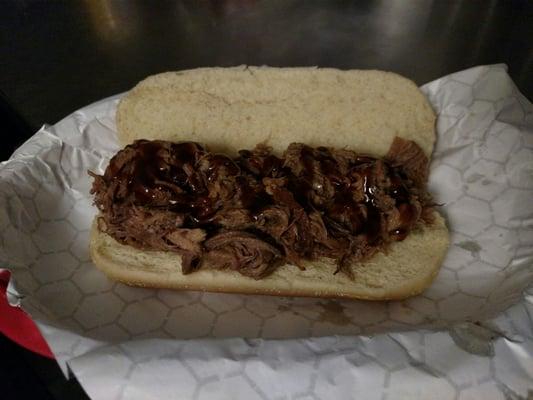 A tasty brisket sandwich with sriracha bourbon barbeque sauce.