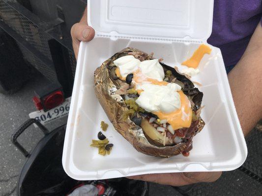 Frank's famous Potato Bomb. Gigantic Idaho smothered with pulled pork BBQ, jalapeño, cheese, sour cream.