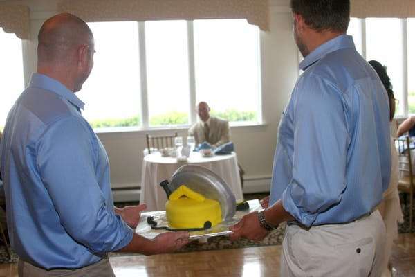 Surprising the groom with a saw cake.