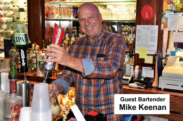 Mike Keenan serving a beer