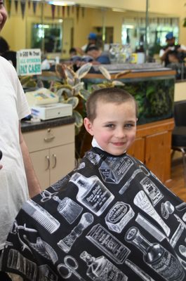 The winner of best smile while sitting in a barber's chair is....