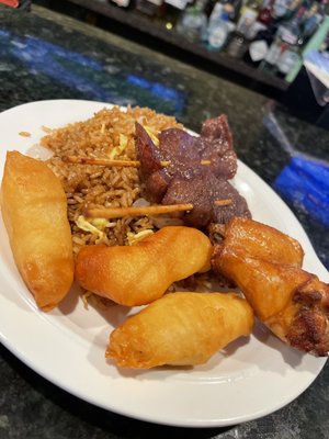 Shrimp fried rice w/ beef teriyaki, chicken fingers and wings.