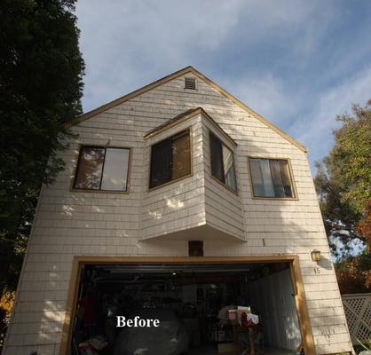 The house before new siding and windows.