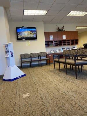 Large waiting room with a TV