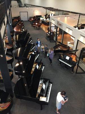 A room full of beautiful pianos