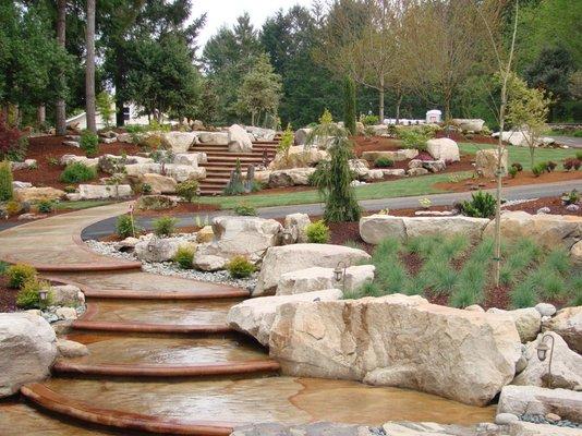 Eld Inlet Residence with a stamped concrete stairway leading to upper parking.