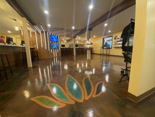 Inside the newest Tamarack Cannabis location in downtown Whitefish, Montana. Custom logo set into the floor.