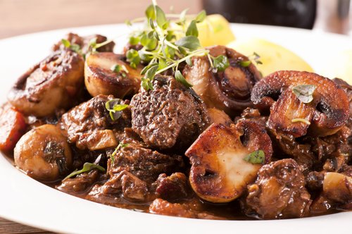 Beef bourguignon with grass fed beef, simmered for hours to be enjoyed with a glass a red wine