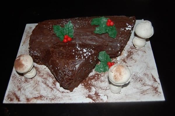 Buche de Noel - chocolate sponge cake with chocolate mousse on main branch and coffee cream on branch.  Covered in choclate.