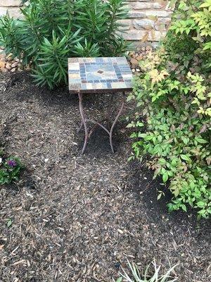 Notice how black the mulch is under the table and the bushes....the rest is washed out after one rain.  Never experienced this before.