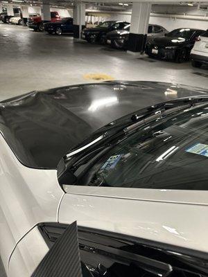 In this picture it looks like cheap wallpaper wrapped on the hood of the car.