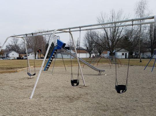 decent sized playground with basic equipment