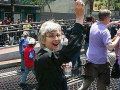 Rev. Anne marching at Pride