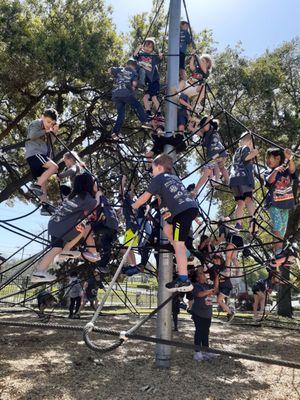 Rope climbing with a large group of kids.