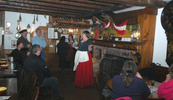 Lynn Feingold performing on the hearth in the Tap Room